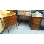 Small furniture: to include a 1930s oak bureau with a fall flap, over a single drawer, raised on
