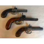 A 19thC double barrelled percussion action pistol; and two similar single barrelled pistols