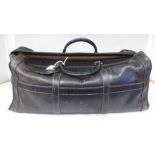 A Dunhill stitched brown hide holdall with a pigskin lined interior and zip closer  approx. 23"w