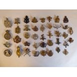 Approx. forty military cap badges and other insignia, some copies: to include (Queen's Own)