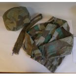 German military equipment, viz. a camouflage fabric helmet cover; a small tunic and strap (Please