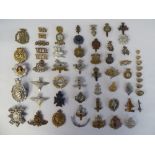 Approx. forty-five military cap badges, buttons, titles and other insignia, some copies: to