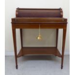 An Edwardian mahogany, string inlaid and marquetry bonheur du jour, having a brass galleried top,