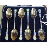 A set of six silver gilt and multi-coloured enamel coffee spoons  BBL  Birmingham 1950