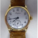 A 1920s Longines 18ct gold round cased wristwatch, No.4558991, faced by a white enamel Arabic dial