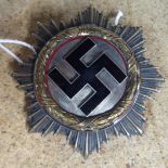 A German Third Reich era breast star with a central black enamel motif (Please Note: this lot is