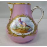 An 18thC French porcelain sparrow beak ewer with pink ground and gilded reserves, painted with an