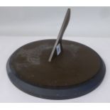 A cast bronze, sundial with an engraved plate, on a turned stone base  12"dia