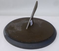 A cast bronze, sundial with an engraved plate, on a turned stone base  12"dia