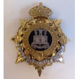 A helmet plate, the Dorsetshire Regiment (Please Note: this lot is subject to the statement made