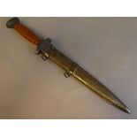 A German World War II period Red Cross leaders dagger with a rib moulded handle and emblem on the