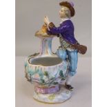 A 19thC Meissen porcelain vase, featuring a seated figure beside a flame and floral encrusted vessel