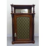 A late Victorian walnut pier cabinet, having a galleried shelf, over a full height door with a