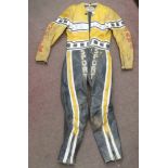 A 1970s TF one piece black and yellow, eagle emblem speedway leathers, bears the rider's name of