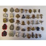 Approx. forty military cap badges and other insignia, some copies: to include Army Cyclist's