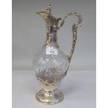 A late 19thC, probably French, cut crystal wine decanter of pear shape design, overlaid in silver