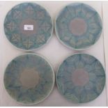 Four Royal Lancastrian pottery plates, decorated with repeating two tone designs  9"dia