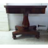 A late William IV mahogany tea table, the rotating, foldover top raised on a pedestal and splayed