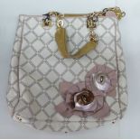 A Versace handbag with floral ornament and chainstrap