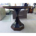A modern (possibly from the Georgio Collection) exotic hardwood effect pedestal centre table  27.5"h