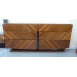 An Alf Italia walnut finished dressing chest with two banks of three drawers, on a plinth  32"h