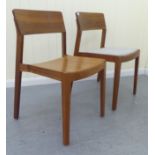 Two similar Dietiker teak framed chairs, bearing labels, one for 2009, the other 2012