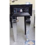 A modern black and clear mirrored single drawer bedside table, raised on tapered legs  29"h  14"w