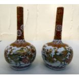 A pair of Japanese Kutani porcelain bottle vases, decorated with peacocks  5"h