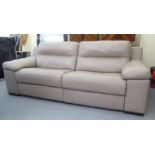 A Violino cream coloured hide, electrically adjustable two person settee  82"w  36"deep