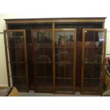 A late Victorian mahogany library bookcase with four glazed doors, enclosing two sections of five