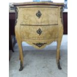 An Edwardian Continental crossbanded string inlaid, walnut, serpentine front, two drawer commode
