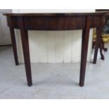 A George III mahogany D-end table extension/side table, raised on square, tapered legs  29"h  47"w