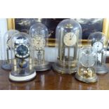 Six early/mid 20thC lacquered brass anniversary style clocks under domes  tallest 14"h