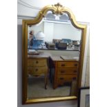 A modern mirror, the arched bevelled plate set in a modern gilt frame  40"h  26"w