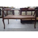 An Edwardian mahogany framed two person cottage settee, raised on slender cabriole forelegs  58"w