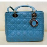 A Christian Dior turquoise coloured leather handbag