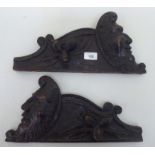 A pair of late Victorian carved oak furniture brackets  7"h  15"L