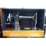 An early 20thC Singer manual sewing machine  no. F6816833  cased