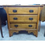 An early 20thC pine three drawer dressing chest, raised on bracket feet  32"h  36"w