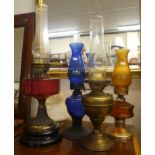 A mixed lot: to include an early 20thC brass, clear and Cranberry coloured glass oil lamp  22"h