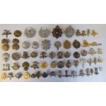 Approx. fifty military cap badges and other insignia, some copies: to include City of London