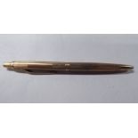 A 9ct gold engine turned cased pen