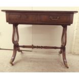 An Edwardian mahogany sofa table with a tooled green leather scriber, over two frieze doors,