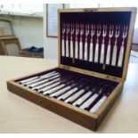 A set of twelve silver fruit knives and forks, on abalone handles  Sheffield 1897  cased