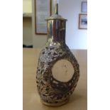 An Oriental dimpled glass scent bottle, overlaid in Sterling silver with floral designs