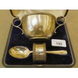 A silver Christening set, comprising a bowl, spoon and napkin ring  Sheffield 1929  cased