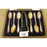 A set of six silver Old English pattern teaspoons; and matching tongs  Sheffield 1920  cased