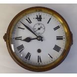 An early 20thC brown painted and part gilded drum shape bulkhead timepiece; the movement with fast/
