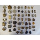 Approx. fifty military cap badges and other insignia, some copies: to include The Lancashire