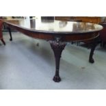 A late Victorian mahogany wind-out dining table, profusely decorated in Anglo-Indian taste with
